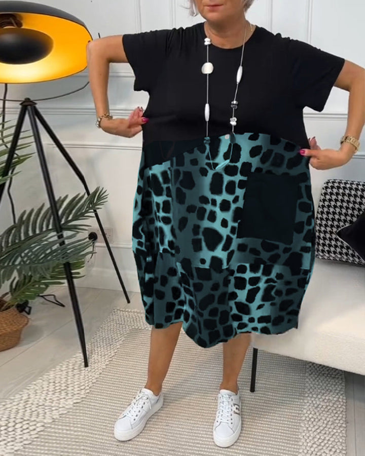 Allison - Stijlvolle midi-jurk met korte mouwen en luipaardprint