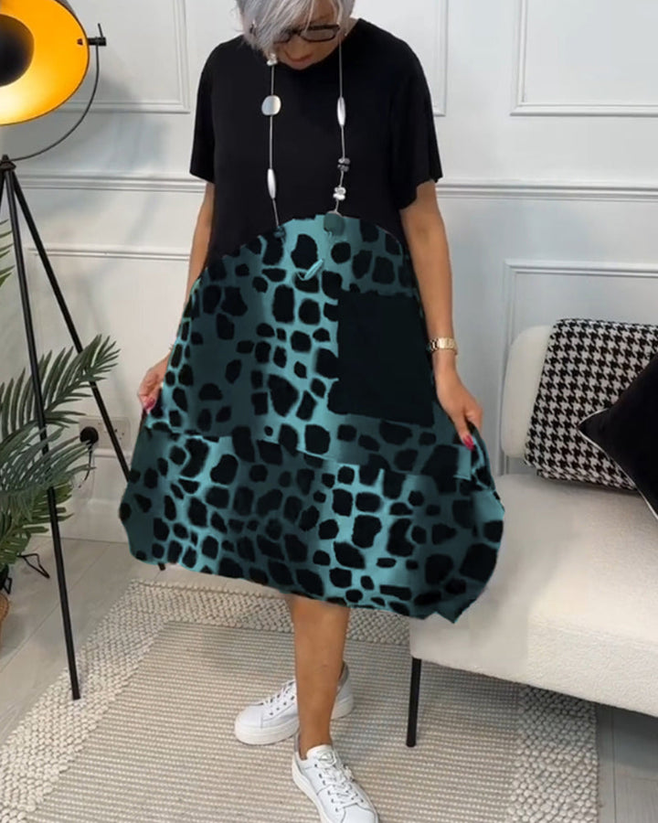 Allison - Stijlvolle midi-jurk met korte mouwen en luipaardprint