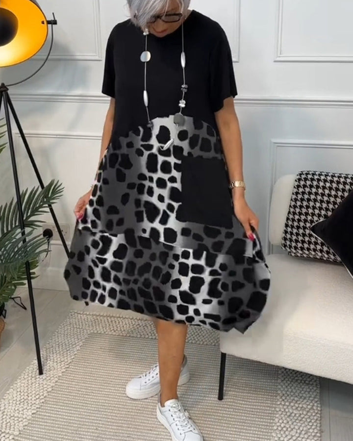 Allison - Stijlvolle midi-jurk met korte mouwen en luipaardprint
