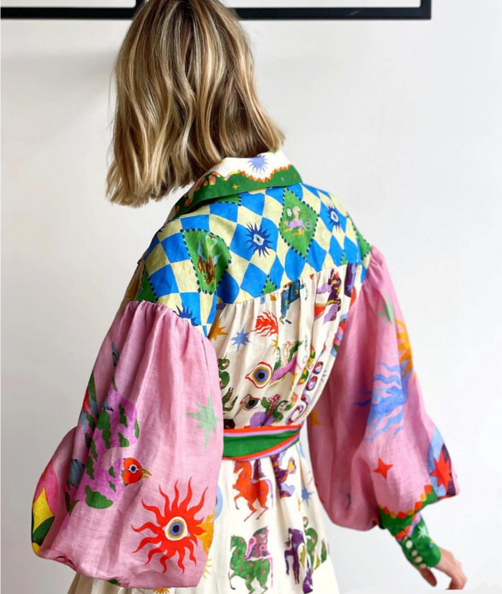 Capri - Chique jurk met strikceintuur en lantaarnmouwen 
